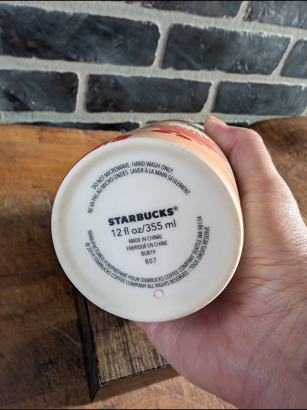 Starbucks White Ceramic Travel Mug with Coral Lid and Pinecone Accent